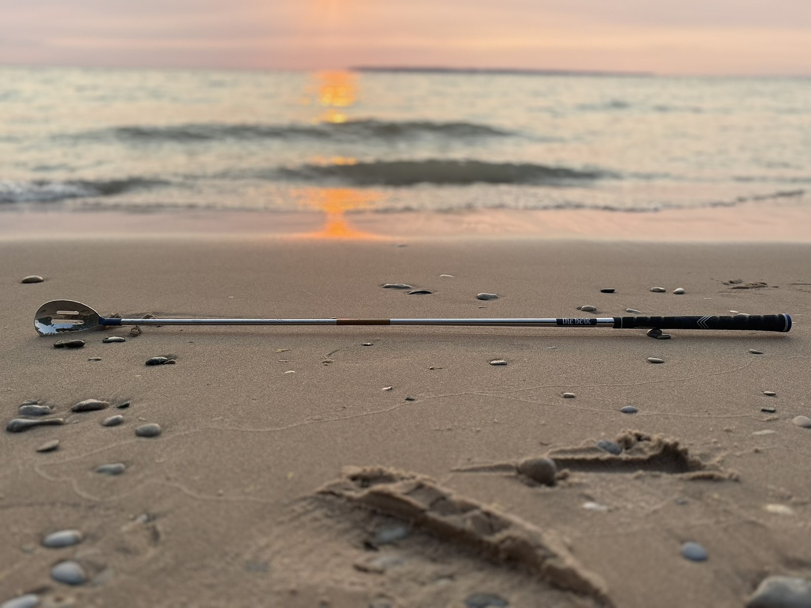 The Rock Spoon lying on the sand at sunset